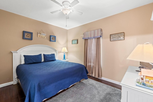 bedroom featuring dark hardwood / wood-style floors and ceiling fan