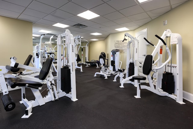 exercise room featuring a paneled ceiling