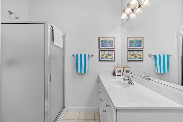 bathroom with tile patterned flooring, an enclosed shower, and vanity