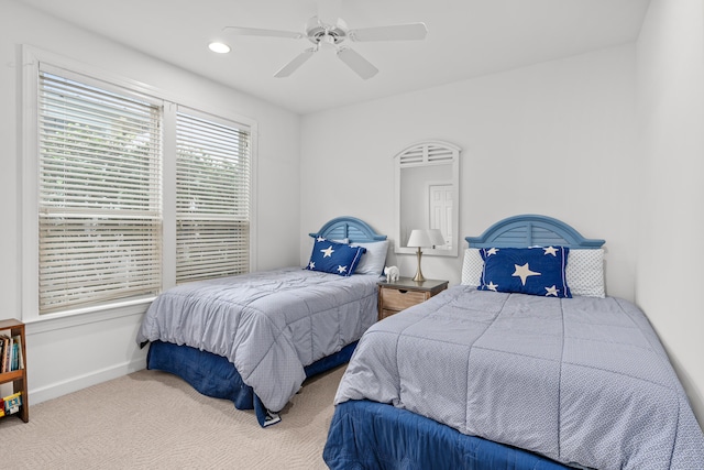 bedroom with ceiling fan and carpet floors