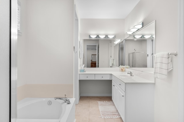 bathroom featuring tile patterned flooring, vanity, and separate shower and tub