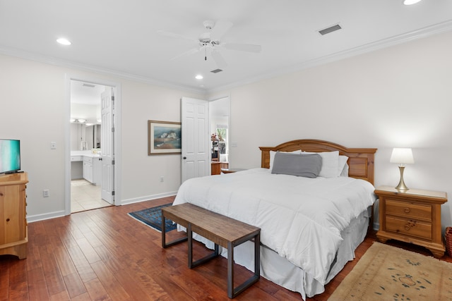 bedroom featuring ceiling fan, ensuite bathroom, wood-type flooring, and crown molding