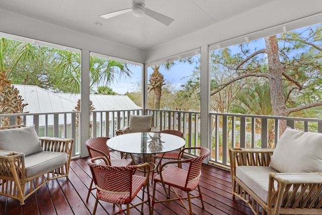 sunroom / solarium with a healthy amount of sunlight and ceiling fan