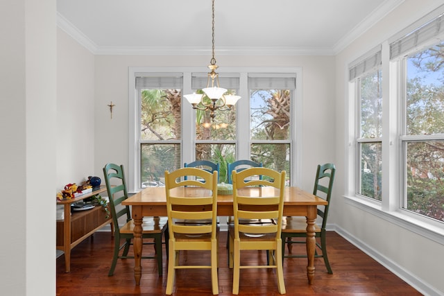 dining space featuring dark hardwood / wood-style flooring, a notable chandelier, and ornamental molding