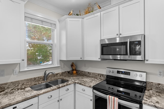 kitchen with white cabinetry, sink, and appliances with stainless steel finishes