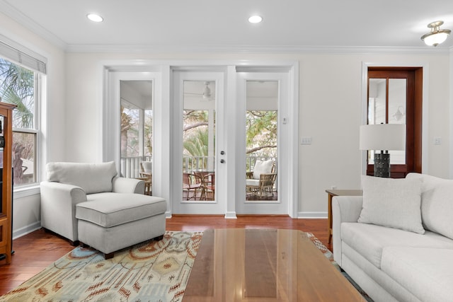 interior space with hardwood / wood-style flooring and crown molding