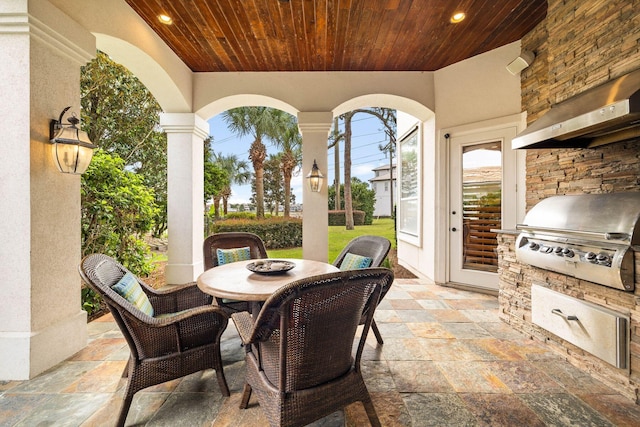 view of patio with a grill and an outdoor kitchen