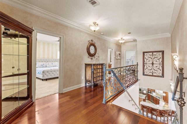 corridor featuring crown molding and hardwood / wood-style floors