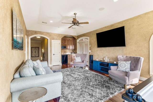 living room featuring hardwood / wood-style flooring and ceiling fan