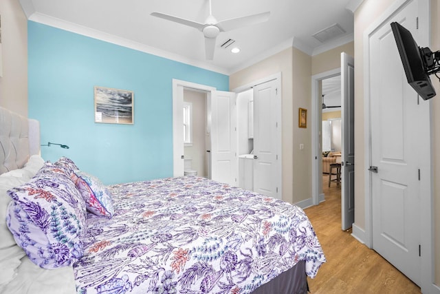 bedroom featuring crown molding, light hardwood / wood-style flooring, a closet, and ceiling fan