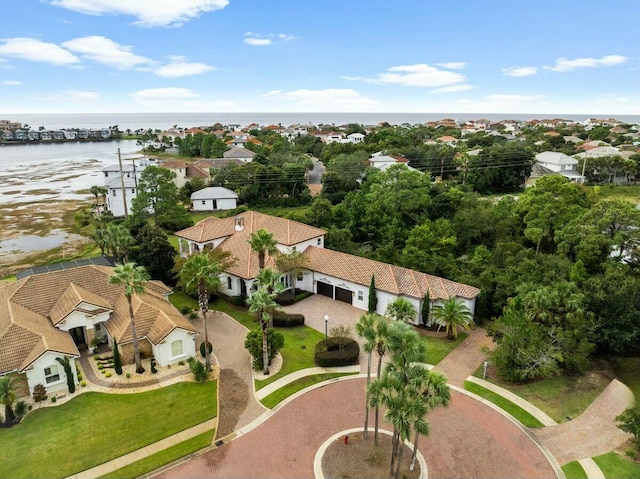 bird's eye view with a residential view and a water view