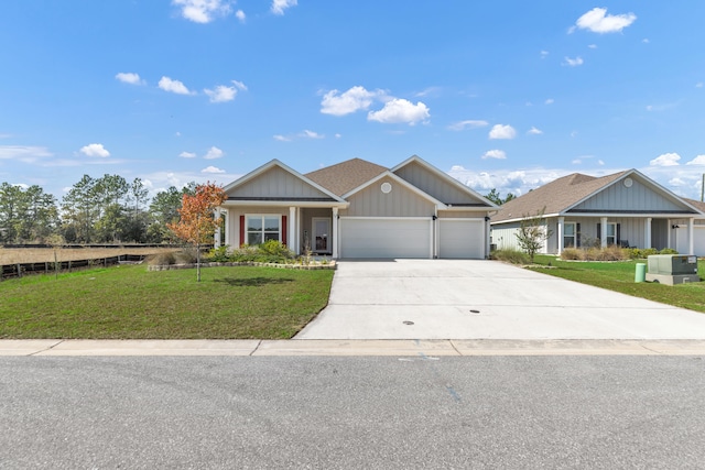 view of front of house with a front lawn and a garage