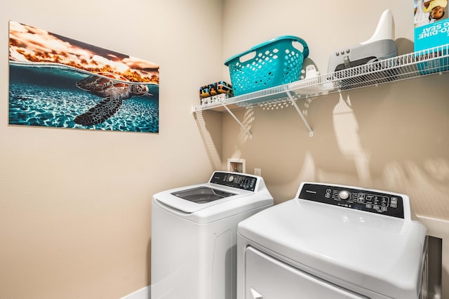 laundry room with independent washer and dryer