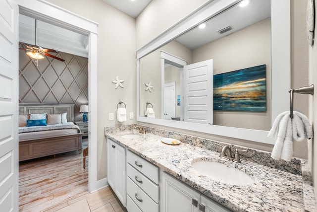 bathroom with vanity, hardwood / wood-style floors, and ceiling fan