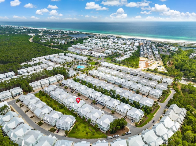 bird's eye view with a water view and a view of the beach