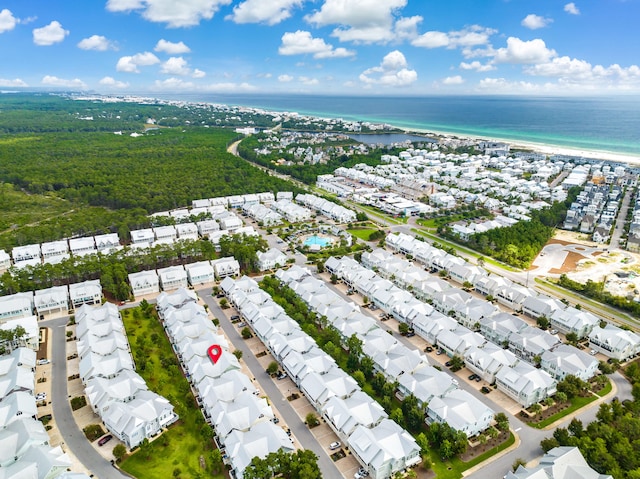 birds eye view of property featuring a water view and a view of the beach