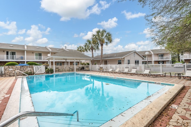 view of swimming pool featuring a patio area