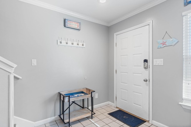 entryway with ornamental molding and light tile patterned floors