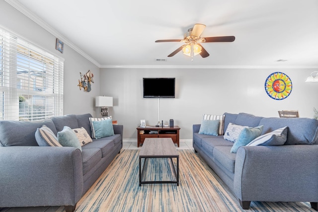 living room featuring ornamental molding and ceiling fan