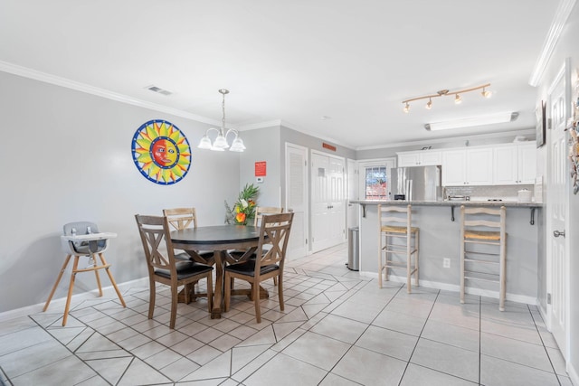 dining room featuring ornamental molding and light tile patterned flooring