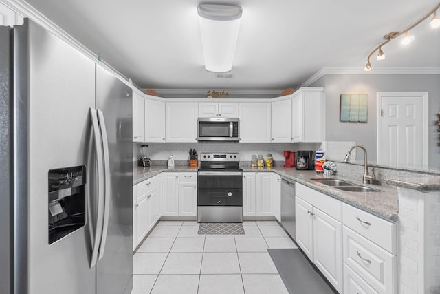 kitchen featuring stainless steel appliances, sink, kitchen peninsula, and white cabinets