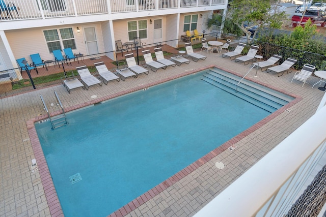 view of swimming pool with a patio area