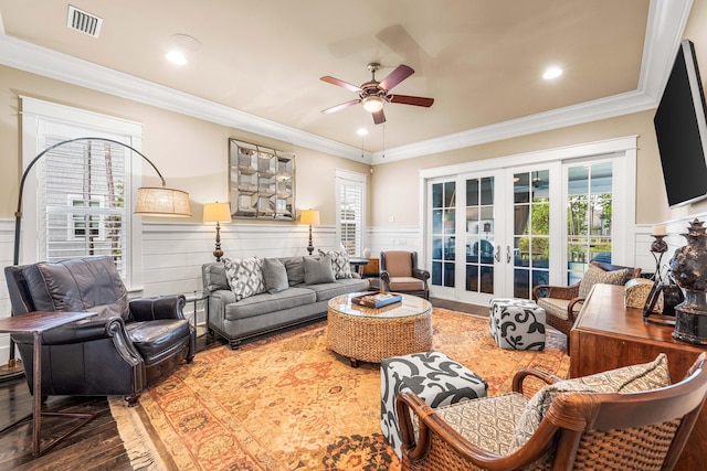 living room with french doors, ceiling fan, wood-type flooring, and ornamental molding