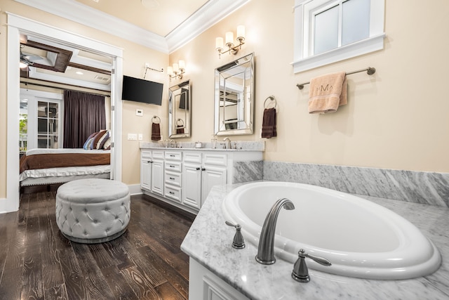 bathroom with a bathing tub, hardwood / wood-style floors, vanity, crown molding, and coffered ceiling