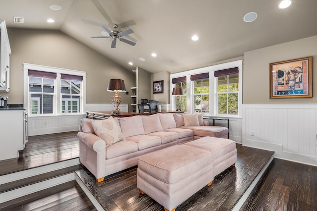 living room with lofted ceiling, dark hardwood / wood-style floors, and ceiling fan