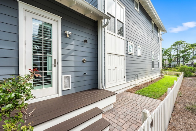 entrance to property featuring a patio