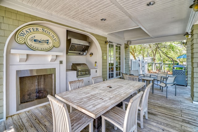 wooden deck with a grill