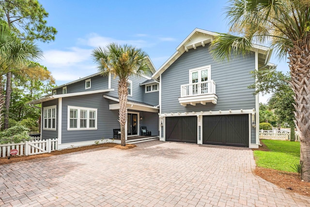 view of front of property with a balcony and a garage