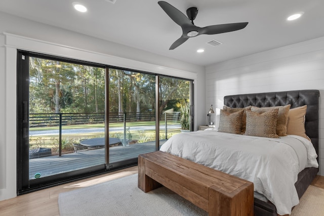 bedroom with ceiling fan, multiple windows, access to exterior, and light wood-type flooring