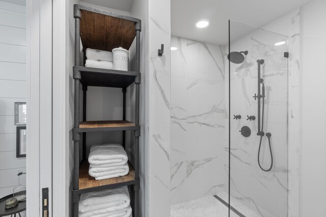 bathroom with tiled shower