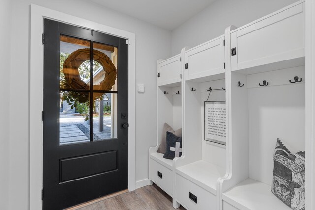 mudroom with light hardwood / wood-style floors