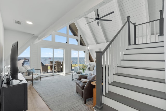 living room featuring high vaulted ceiling, beam ceiling, ceiling fan, and light hardwood / wood-style flooring