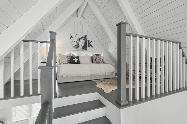 bedroom with wooden ceiling and vaulted ceiling with beams