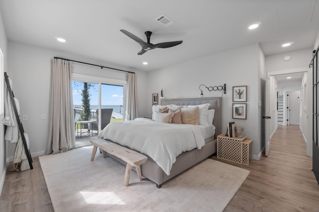 bedroom featuring light wood-type flooring, ceiling fan, and access to exterior
