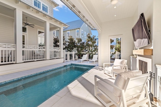 view of pool featuring ceiling fan and a patio