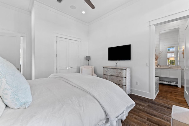 bedroom featuring dark hardwood / wood-style flooring, a closet, ceiling fan, and ornamental molding