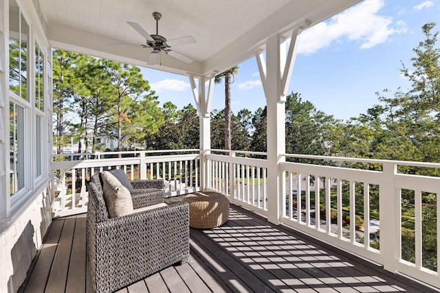 deck featuring ceiling fan and an outdoor hangout area