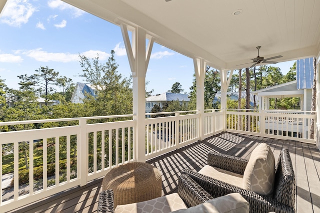 wooden terrace featuring ceiling fan