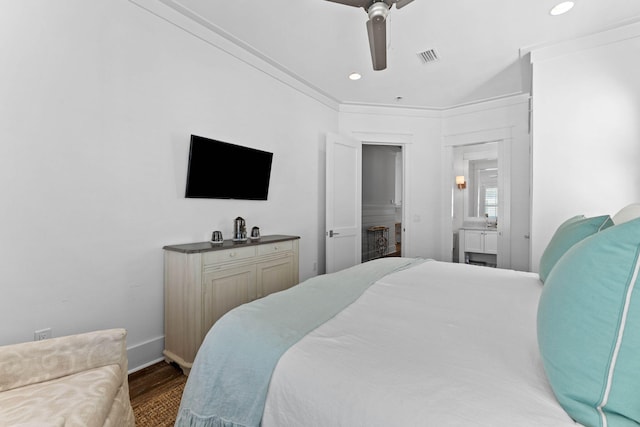 bedroom with crown molding, ceiling fan, and dark wood-type flooring