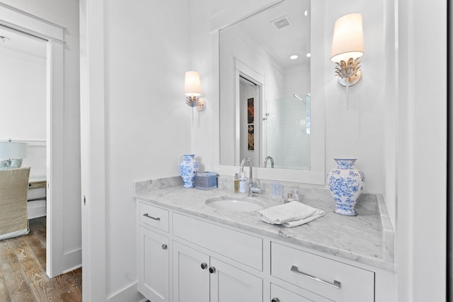 bathroom with vanity and hardwood / wood-style flooring