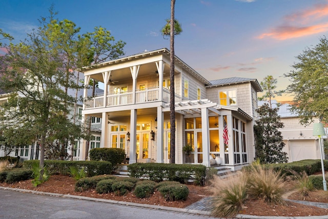 view of front facade with a balcony and a pergola