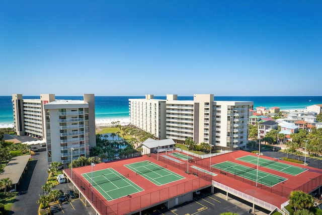 bird's eye view with a water view and a beach view