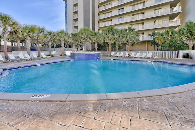 community pool featuring fence
