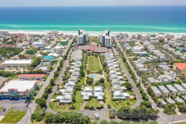 drone / aerial view with a residential view, a beach view, and a water view