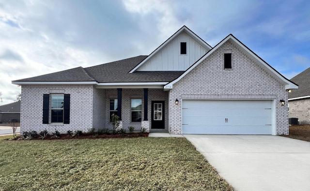 view of front of home featuring a garage and a front lawn