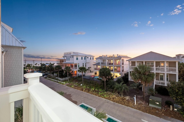 view of balcony at dusk